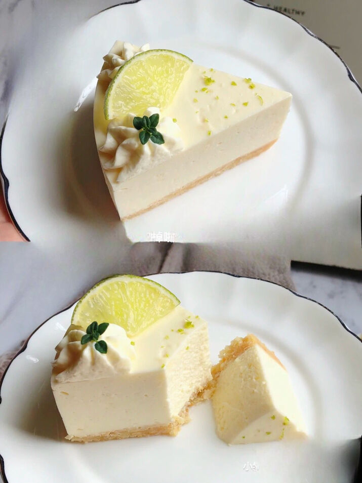 A no-bake lemon cheesecake decorated with lemon slices, whipped cream, and lime zest, placed on a marble surface with a golden fork.