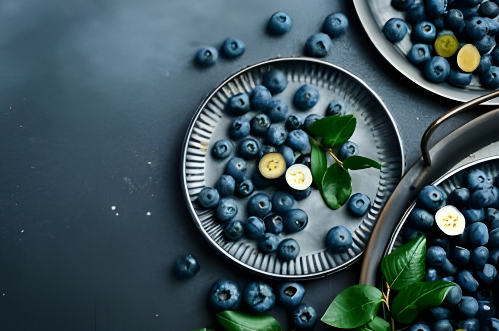  A plate of blueberries.  The blueberries are round and blue with a whitish bloom."[bloom refers to the waxy coating on some fruits]"