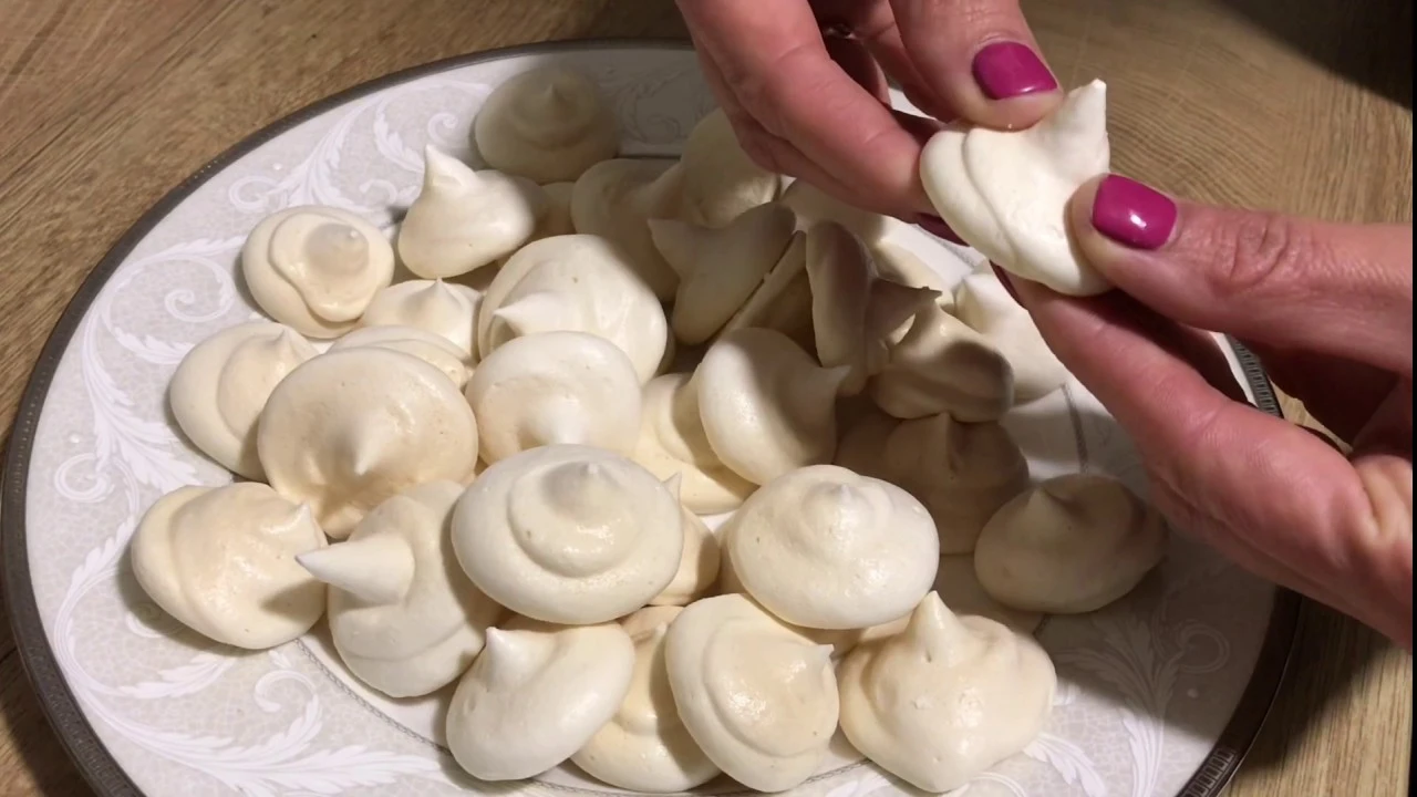 Close-up of a plate filled with perfectly baked vegan meringues made using aquafaba