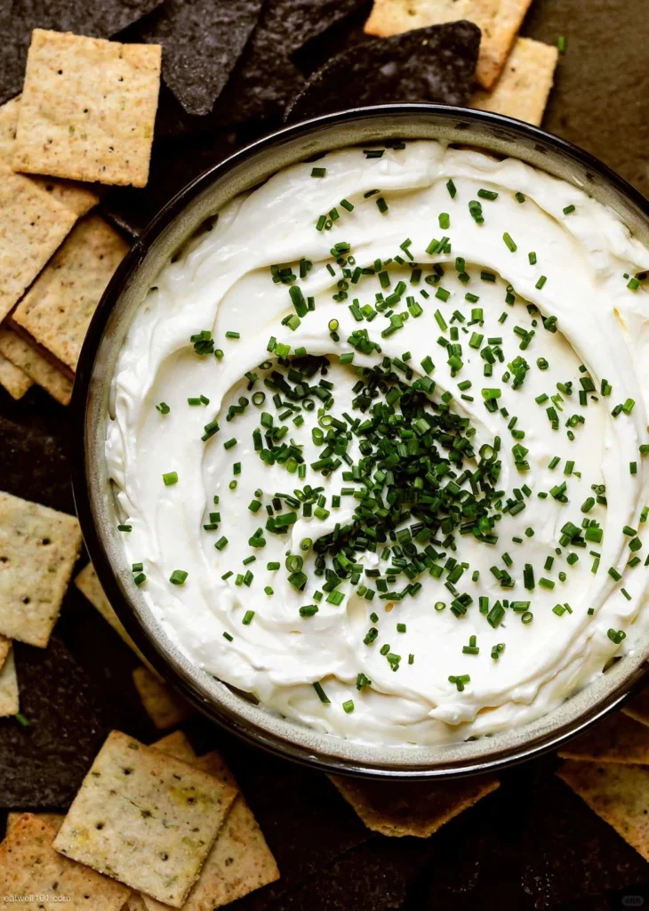 Creamy white dip topped with fresh chives, served with assorted crackers