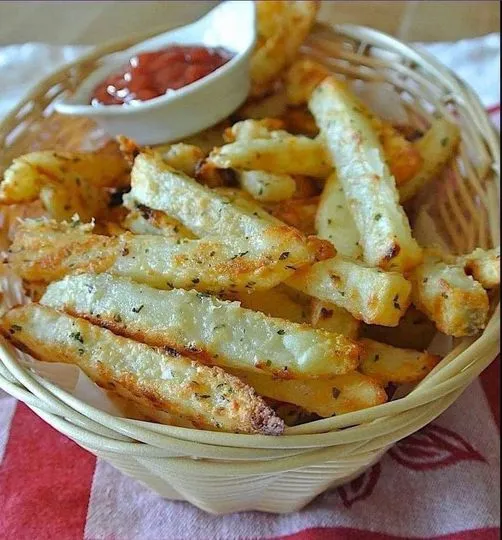 Basket of Crispy Baked Garlic Parmesan Fries with Dipping Sauce