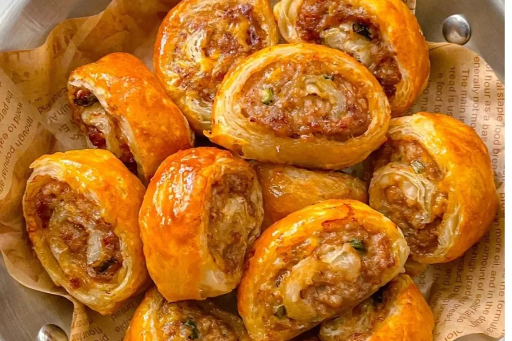 Golden, crispy minced meat and scallion rolls freshly baked and ready to serve